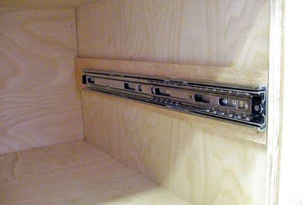 How to pull out a drawer from a modern kitchen set