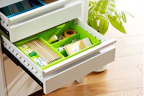 Office storage in the drawer of the bedside table