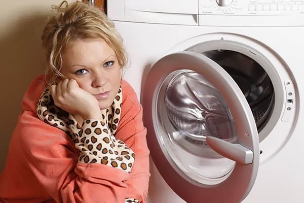 Woman at the washing machine