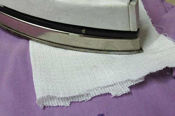 Removing silicone stains with iron and gauze