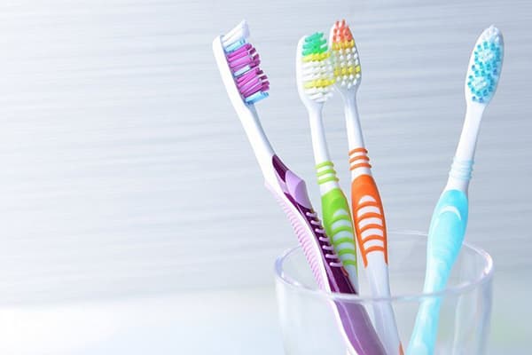 Toothbrushes in a glass