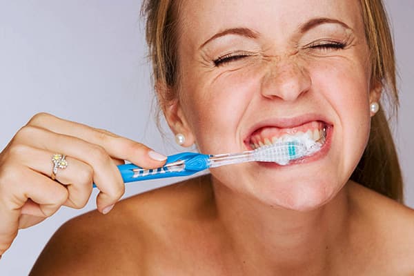 Girl brushing her teeth