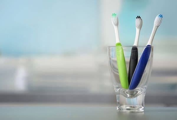 Toothbrushes in a glass