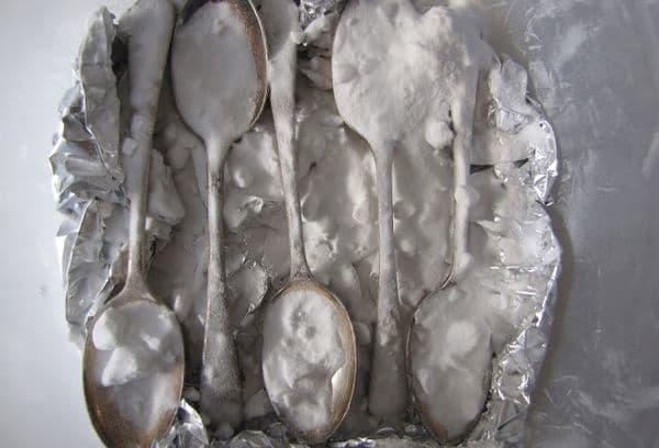 silver spoons in soda