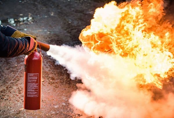 Extinguishing a fire with a fire extinguisher