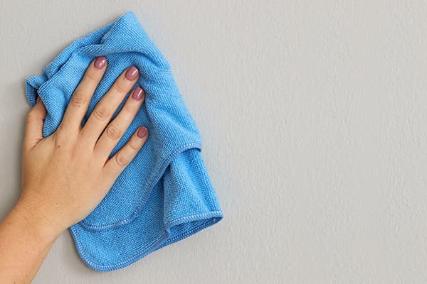 Wipe the painted wall with a microfiber cloth