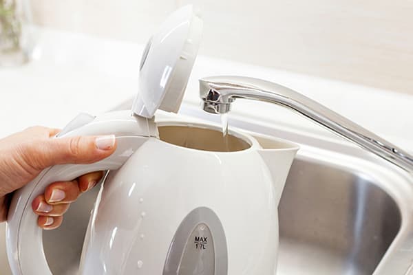 Filling the kettle with tap water