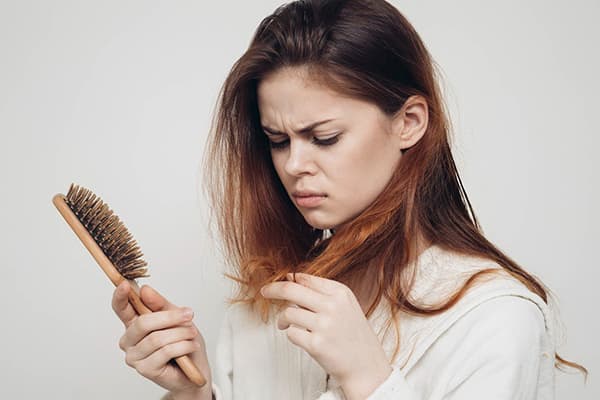 The girl's hair is falling out