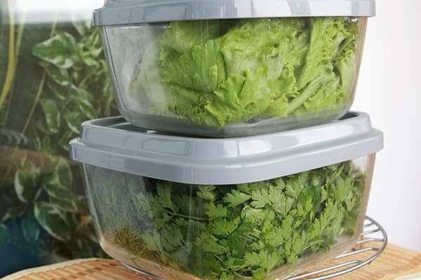 Greens in plastic containers