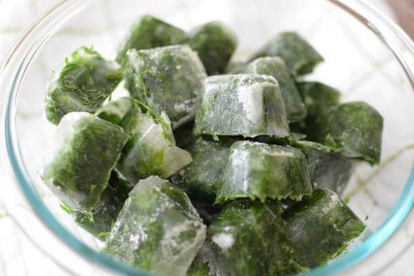 Parsley freezing in the form of ice cubes
