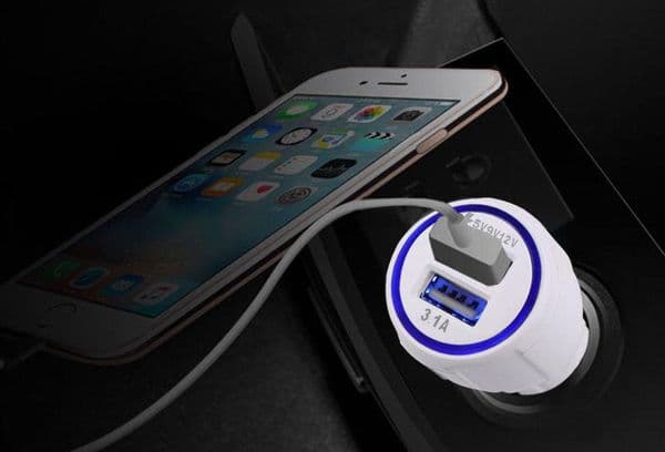 The phone is charging in the car