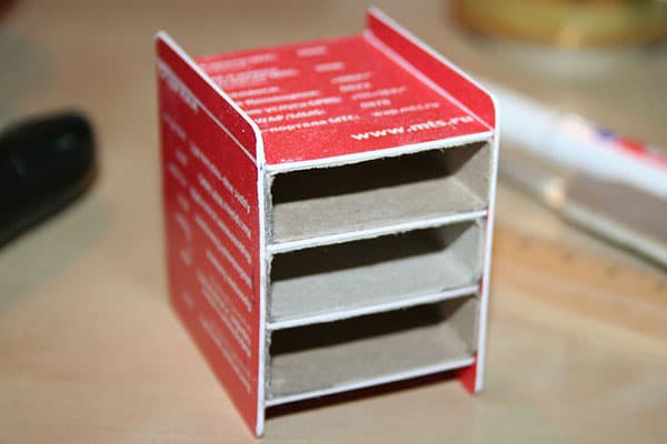 Mini chest of drawers with plastic cards and matchboxes