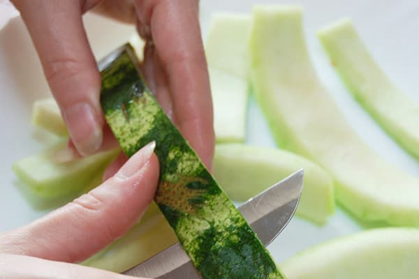 Cleaning watermelon peels for candied fruit