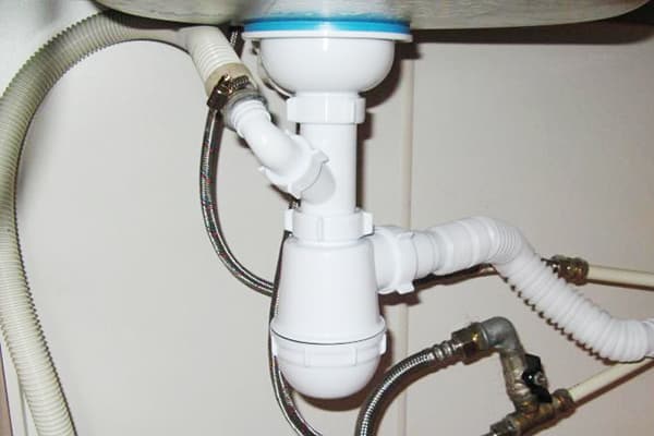 Drain the washing machine through a siphon