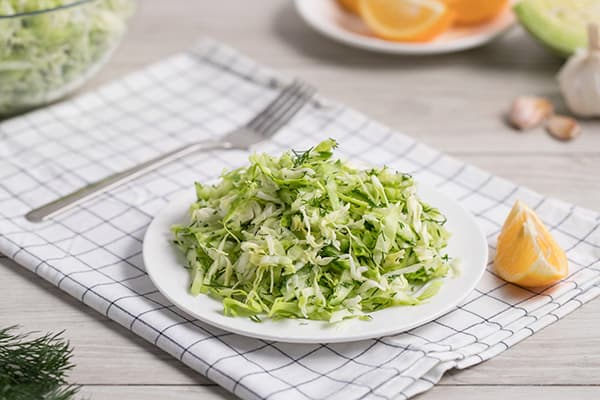 Light salad and cooking utensils
