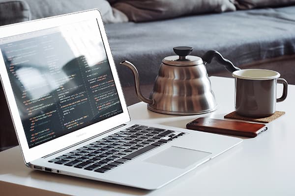 Netbook and coffee on the coffee table