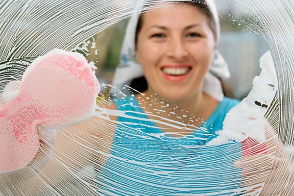 Woman washes a glass