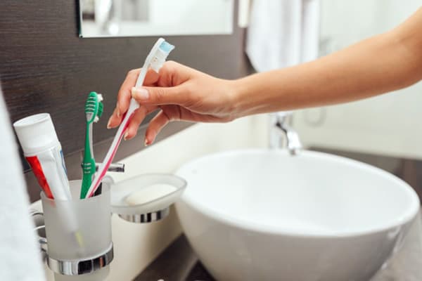 Using a toothbrush