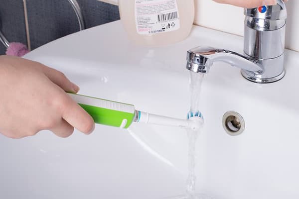 Toothbrush washing under the tap