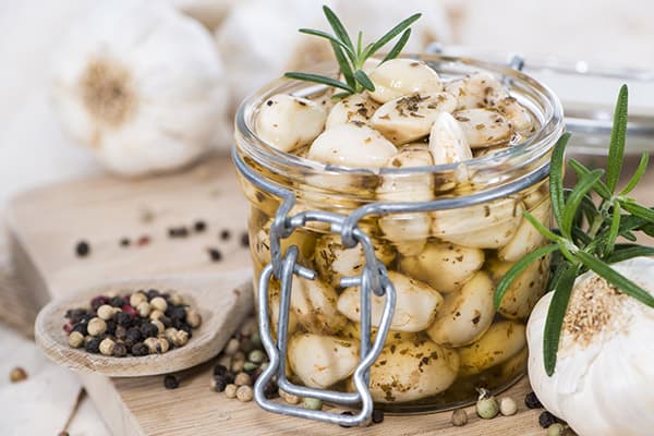 Garlic cloves in oil with spices
