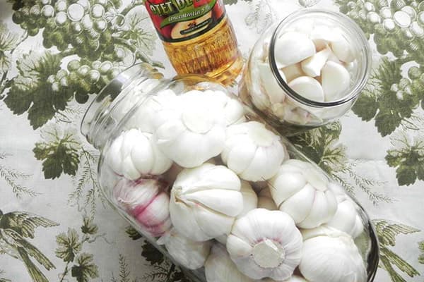 Garlic heads in a glass jar
