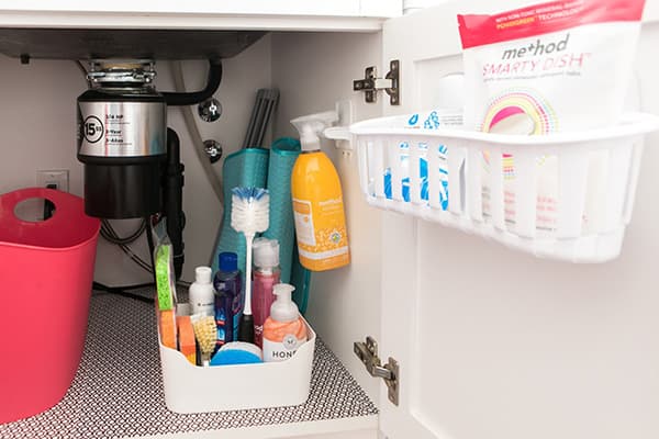 Organizers in the cabinet under the sink in the kitchen