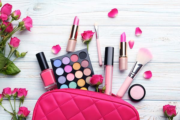 Cosmetics in a pink cosmetic bag