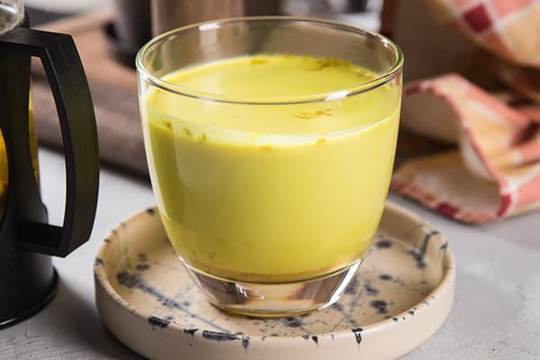 A glass of milk with turmeric